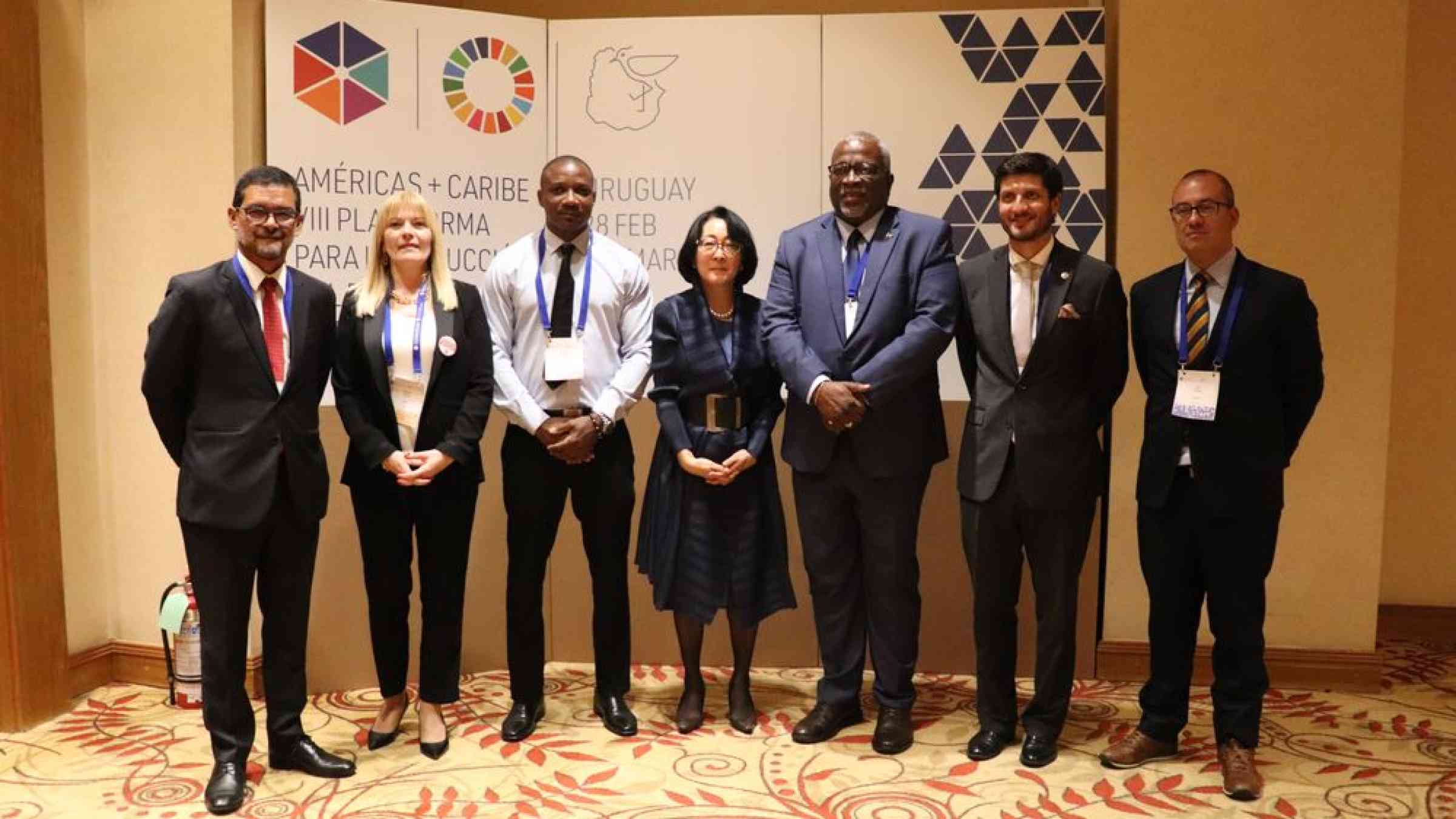 people in a group photo at a conference