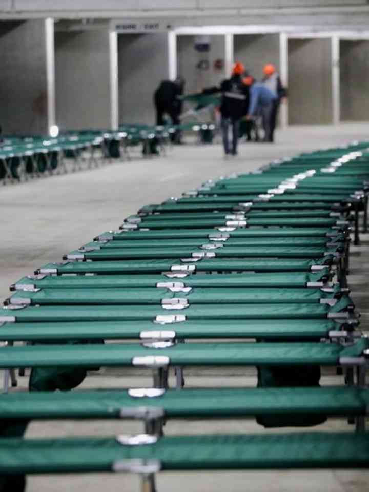 Shelter with camp folding cots